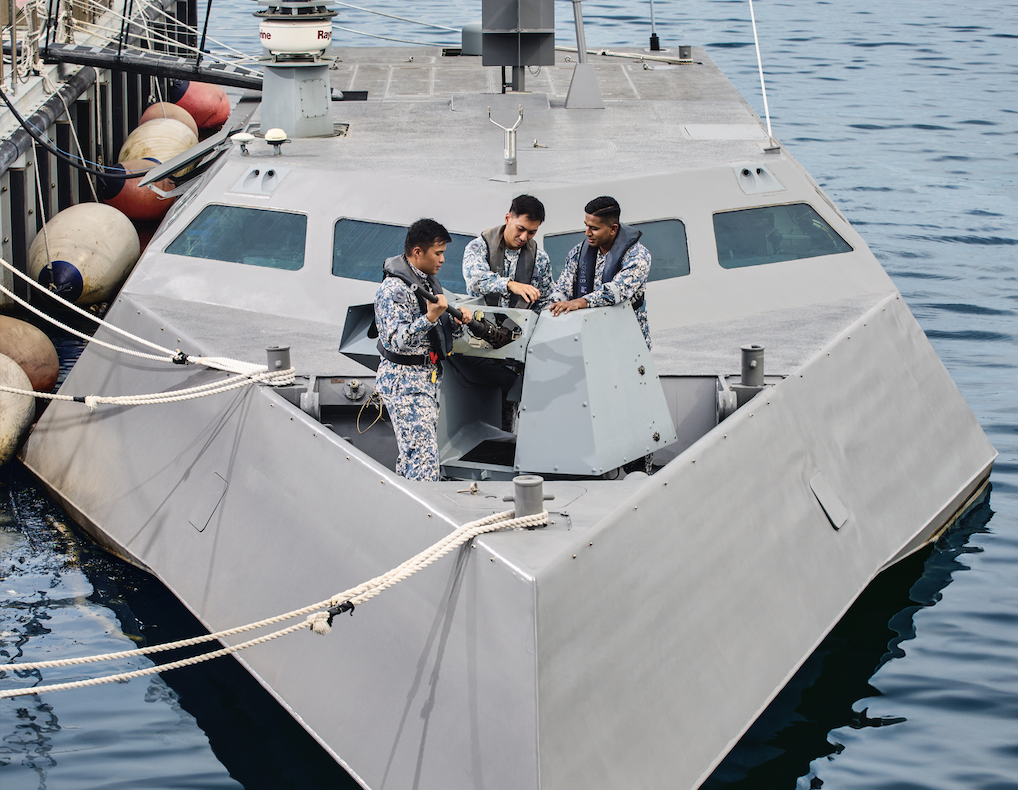 One RSN Engineer overseeing the maintenance on board a craft that is dock.